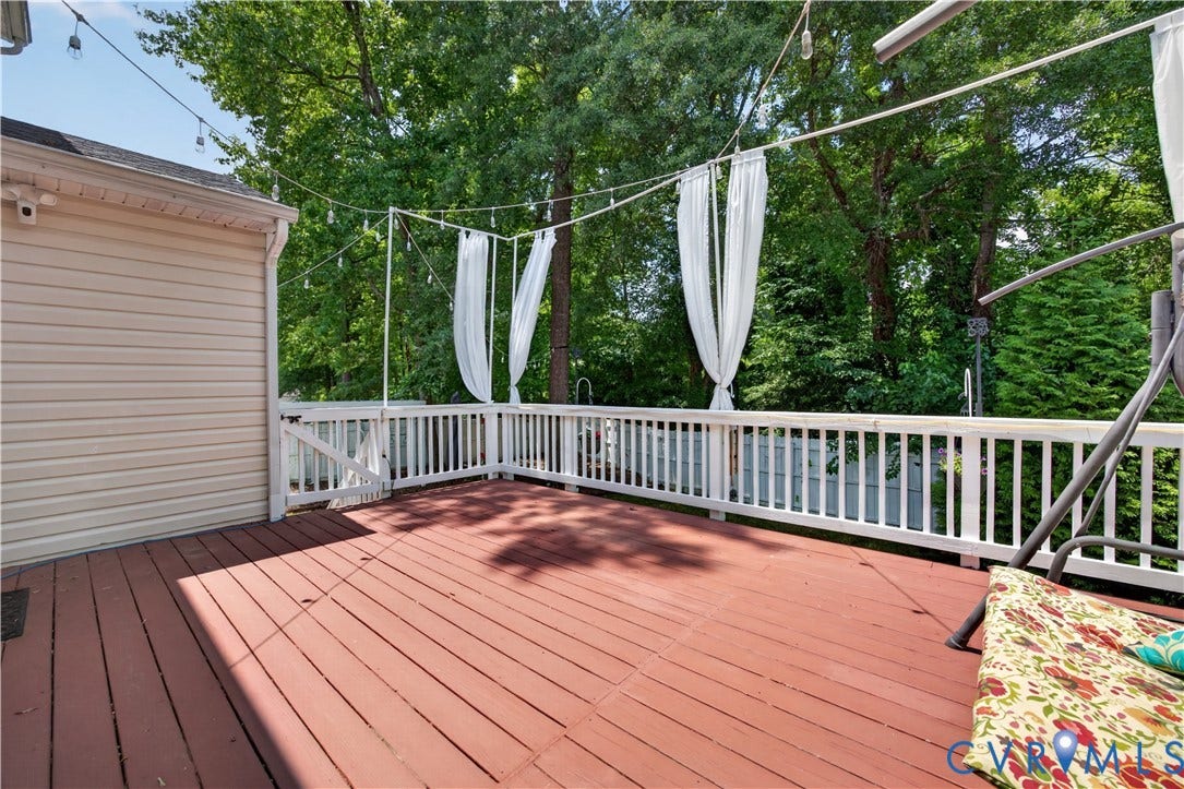 9516 Hungary Woods Drive, Henrico, VA 23060 Spanish light with outdoor curtains. Ready to host a brunch party