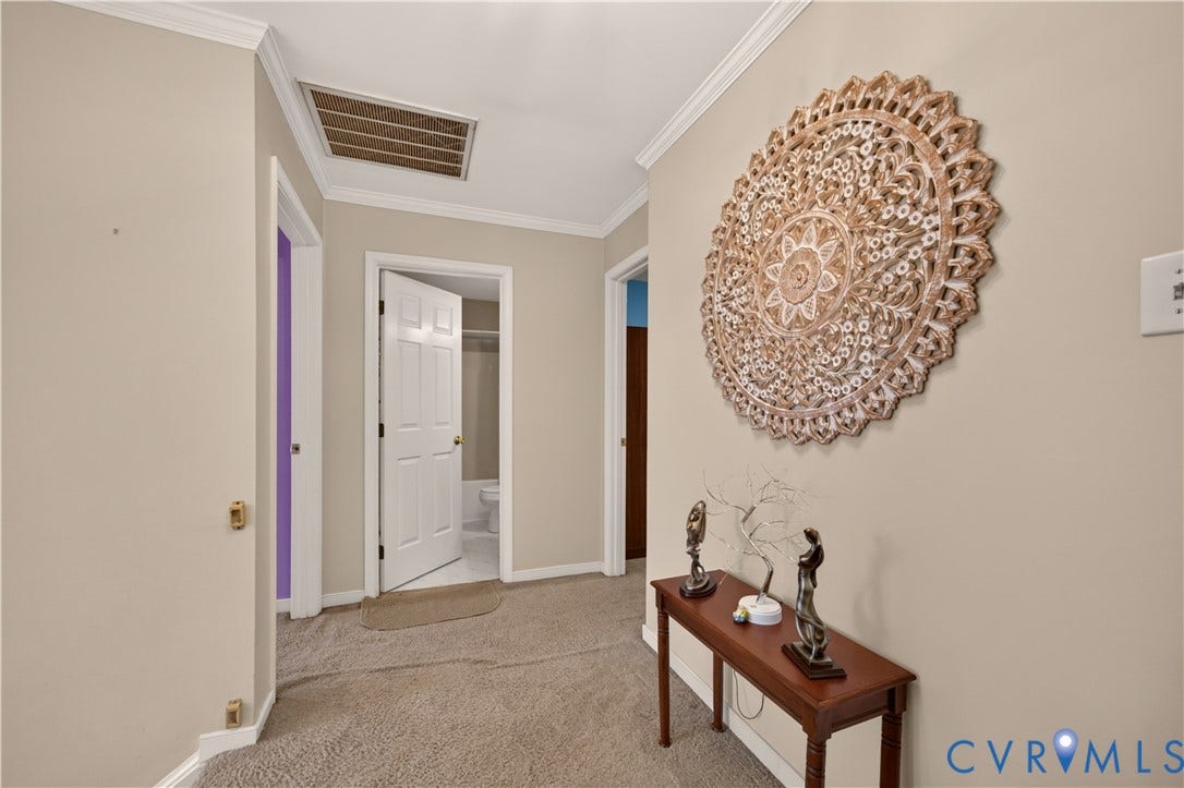 9516 Hungary Woods Drive, Henrico, VA 23060 Hallway with crown molding and carpet flooring