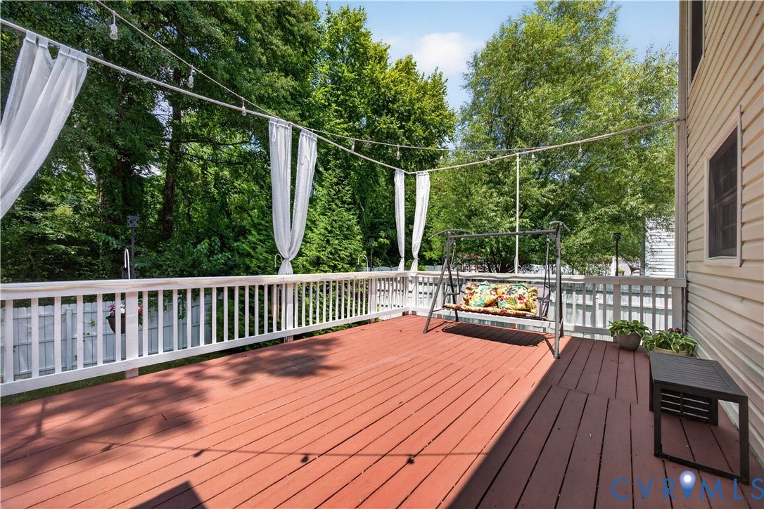 9516 Hungary Woods Drive, Henrico, VA 23060 Expansive deck featuring red-toned wood flooring and white railings