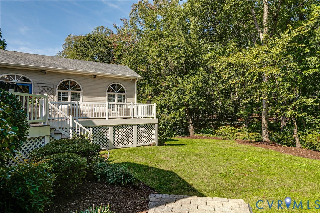 Expansive green lawn with mature trees