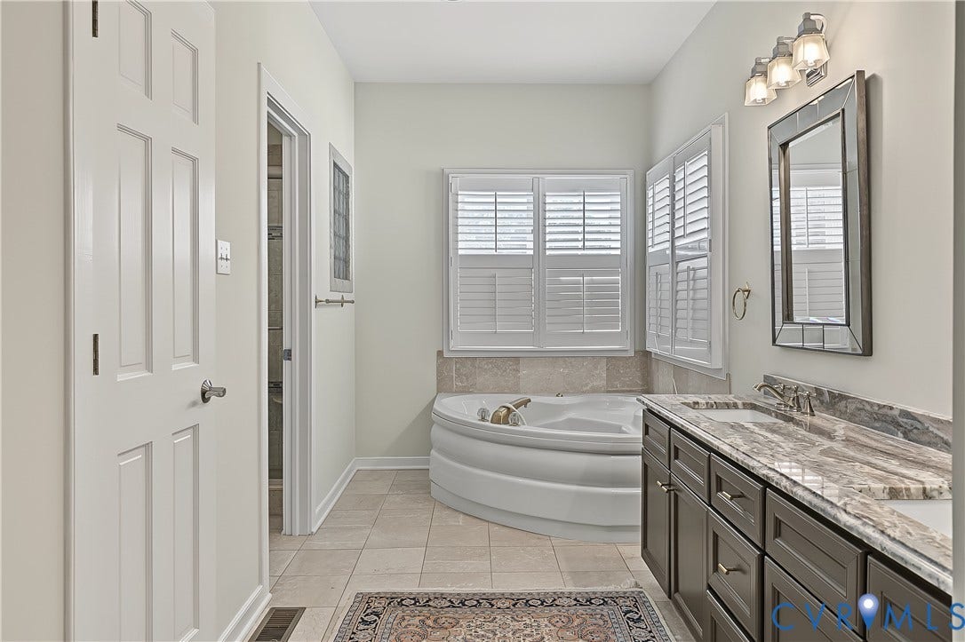 Granite, dual vanity, platation shutters