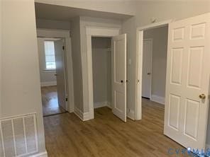 3119-A 4th Avenue, Richmond, VA 23222 Wood-finish flooring throughout, white painted trim, and a built-in closet with bifold doors
