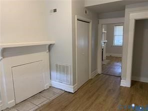 3119-A 4th Avenue, Richmond, VA 23222 Interior features wood-finish flooring, a white mantel, and a built-in closet