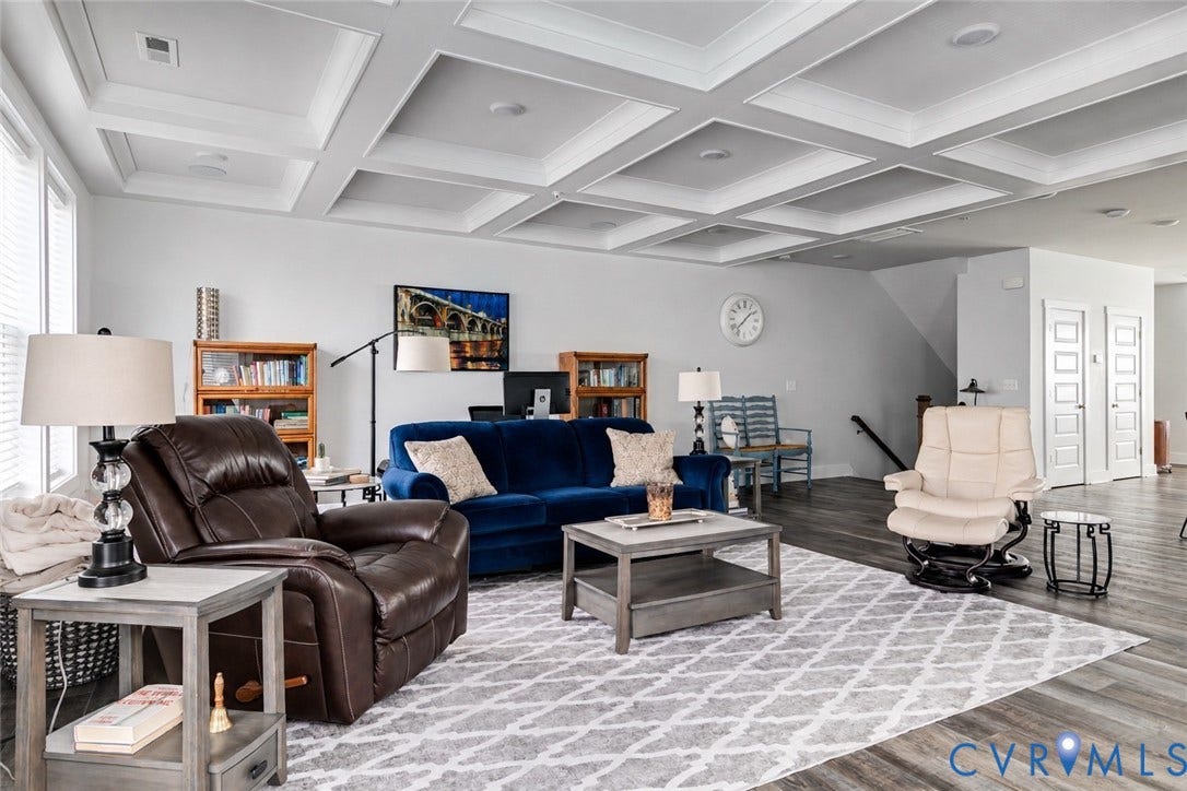 2 Flatwater Row, #B, Rocketts Landing, Henrico, VA 23231 Coffered ceiling, wood-finish flooring, white walls, white paneled doors, and a visible staircase