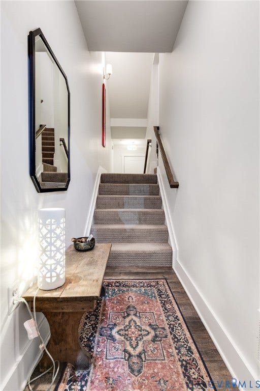 2 Flatwater Row, #B, Rocketts Landing, Henrico, VA 23231 Carpeted staircase with wood-finish handrail, white painted walls, and wood-finish flooring