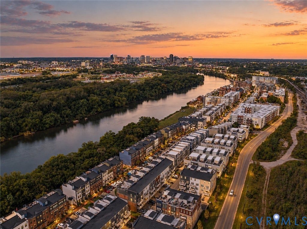 2 Flatwater Row, #B, Rocketts Landing, Henrico, VA 23231 Riverfront residential properties with urban skyline backdrop