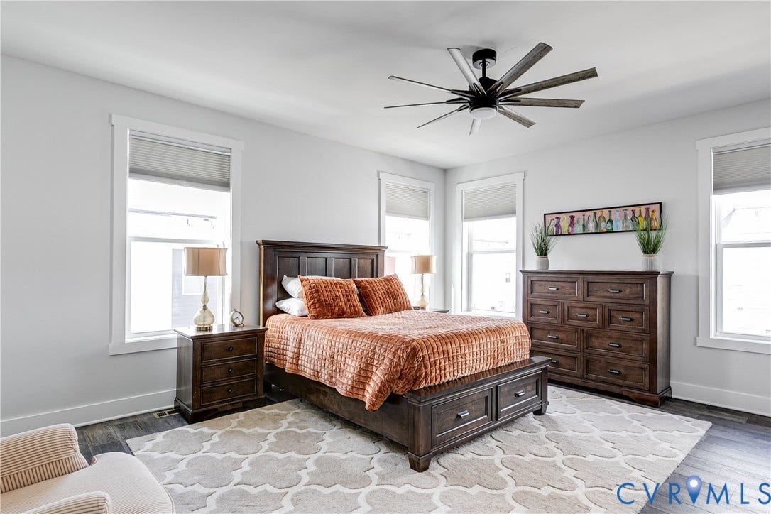 2 Flatwater Row, #B, Rocketts Landing, Henrico, VA 23231 Multiple windows, dark wood-finish flooring, and a contemporary ceiling fan with integrated lighting
