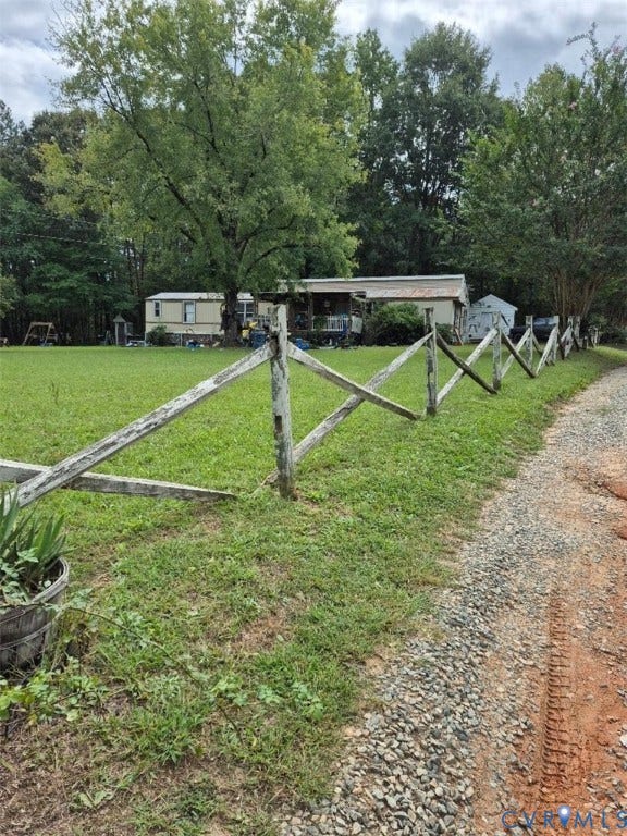 1586 Signboard Road, Bumpass, VA 23024 Rustic split-rail fencing defines the perimeter of this expansive pastoral property, with mature trees providing natural screening and shade