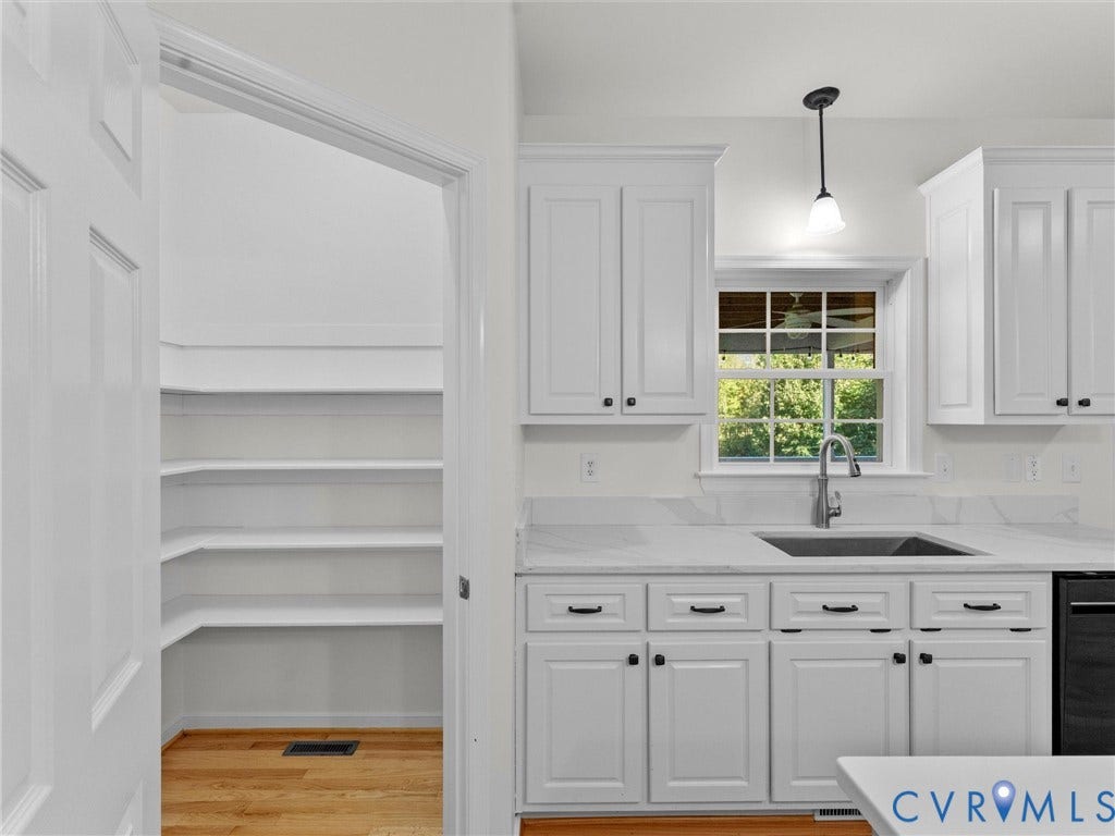 2354 Camelback Road, Maidens, VA 23102 Ample pantry with shelving, stainless rectangular sink with window