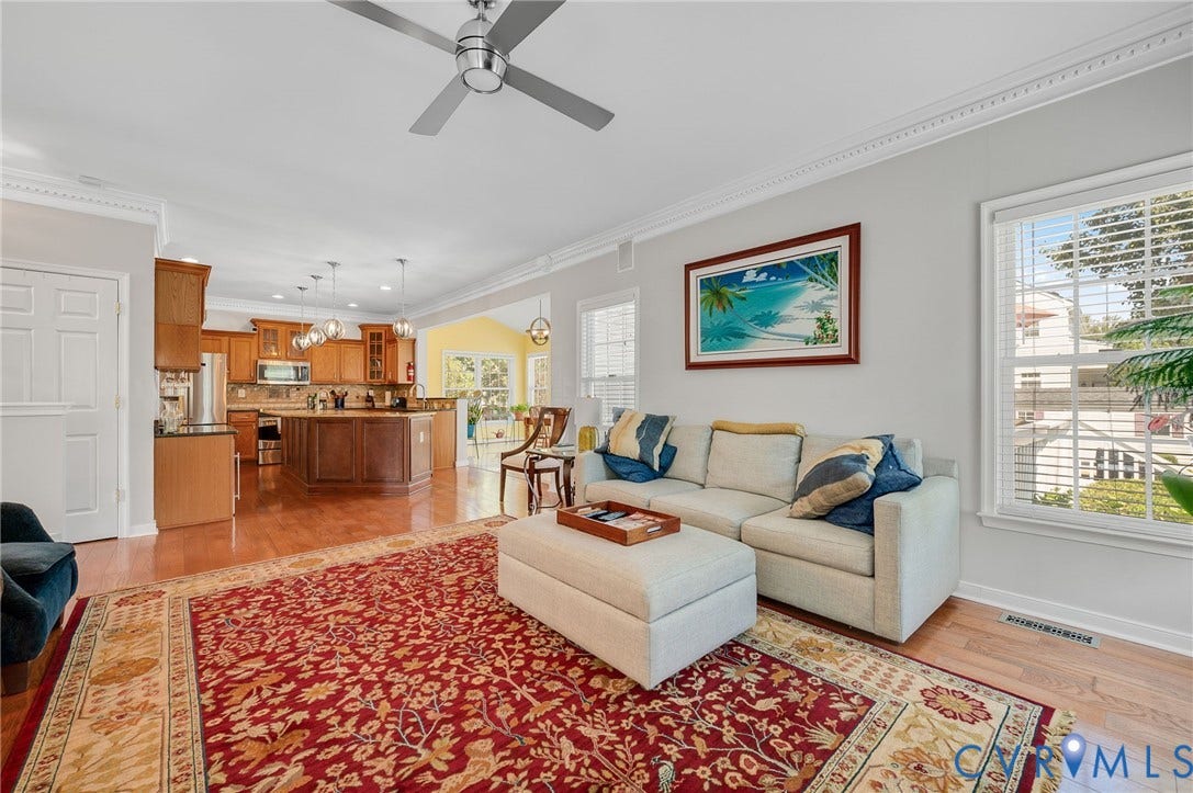 10808 Pruett Lane, Henrico, VA 23059 Wood-finish flooring throughout, crown molding detail, recessed lighting, ceiling fan, and large windows with blinds