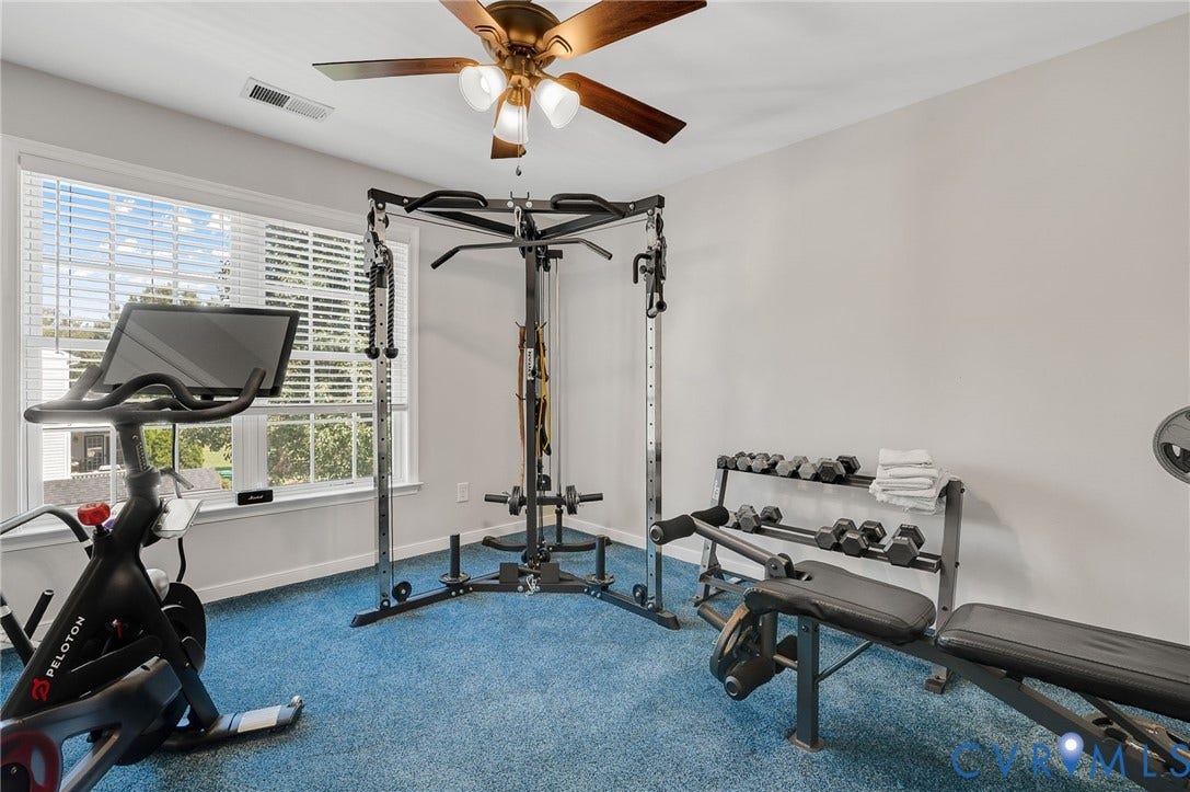 10808 Pruett Lane, Henrico, VA 23059 Room with blue carpet, a window with blinds, and a ceiling fan with integrated lighting