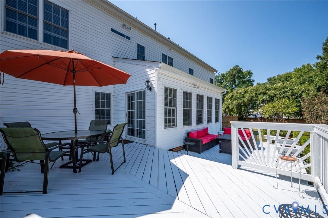 10808 Pruett Lane, Henrico, VA 23059 Expansive white painted deck with a sunroom addition and white siding
