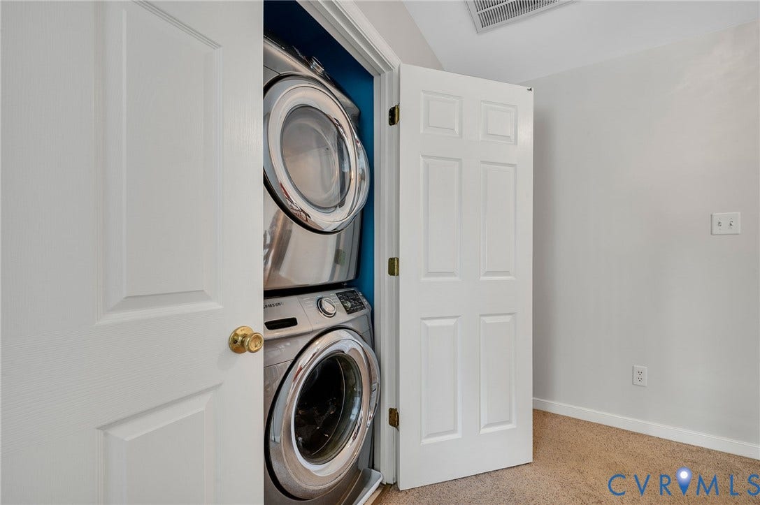 10808 Pruett Lane, Henrico, VA 23059 Dedicated laundry area featuring a stackable washer and dryer within a built-in closet