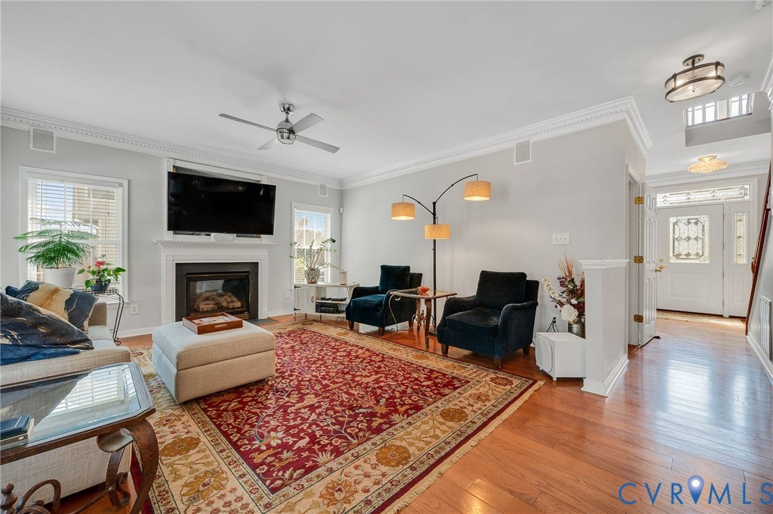 10808 Pruett Lane, Henrico, VA 23059 Hardwood flooring throughout, crown molding, built-in fireplace with mantel, ceiling fan, and decorative glass entry door