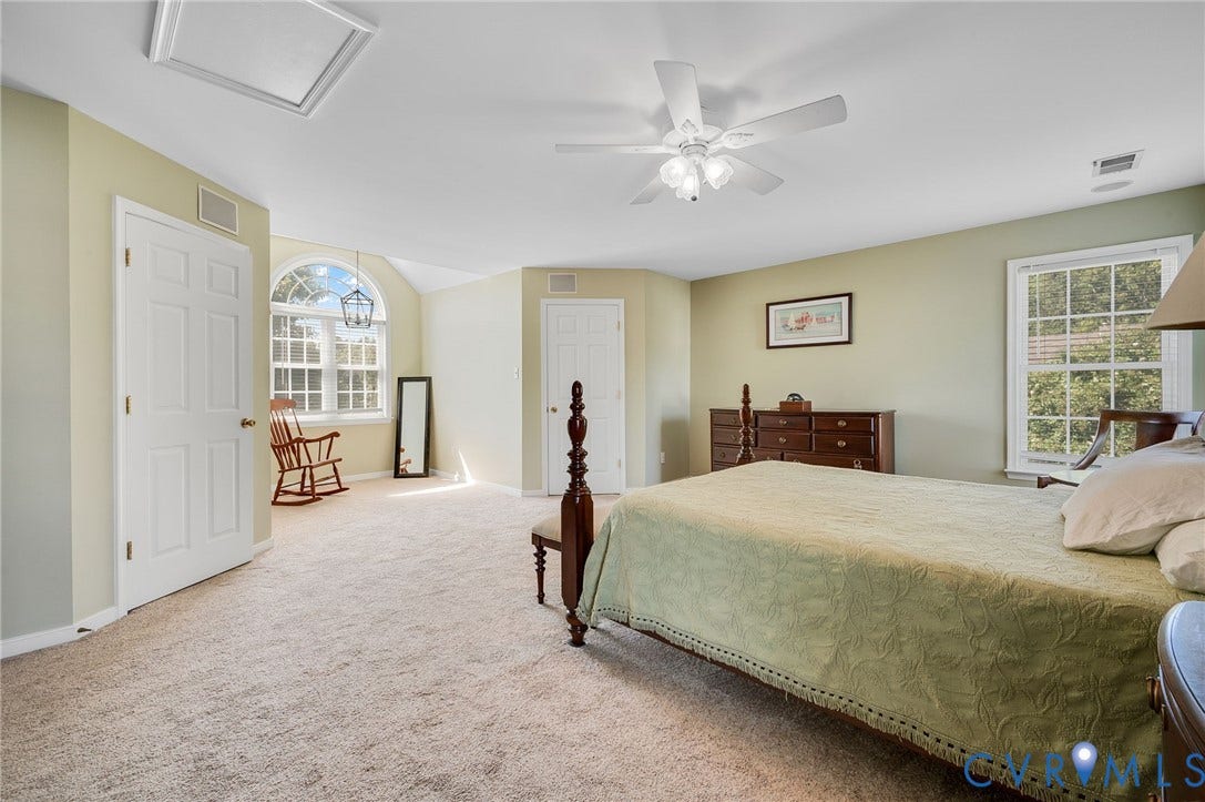 10808 Pruett Lane, Henrico, VA 23059 Carpeted flooring, vaulted ceiling, arched window, ceiling fan, and transom window
