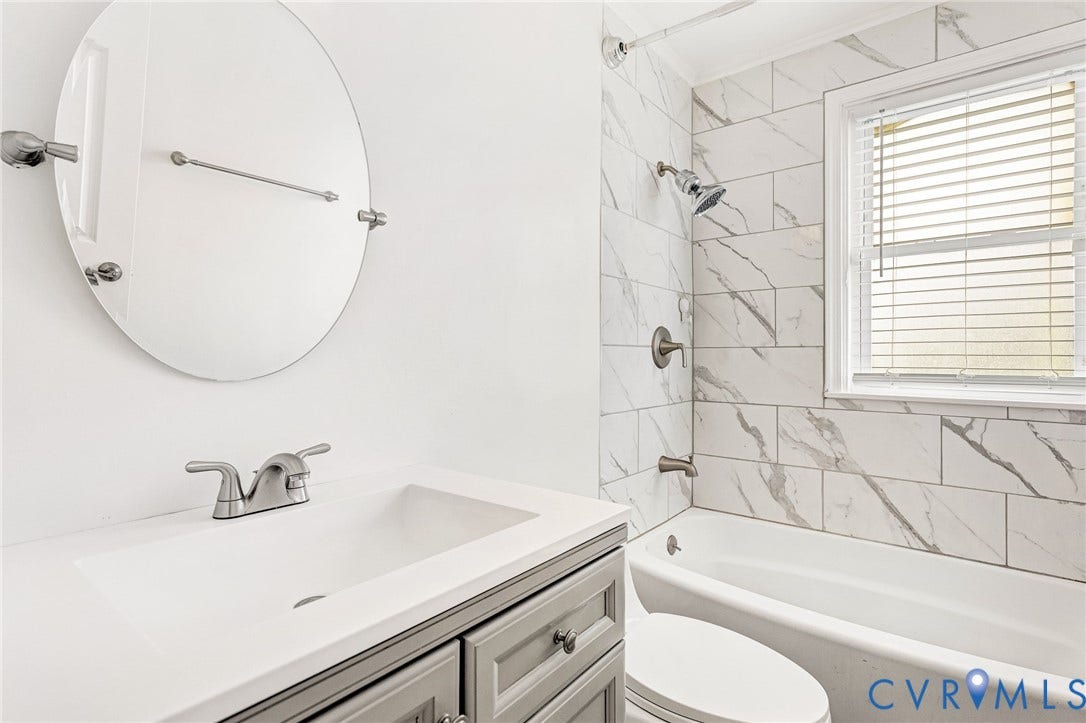 3504 Meadowbridge Road, Richmond, VA 23222 Marble tile shower surround with a window. 1st Floor