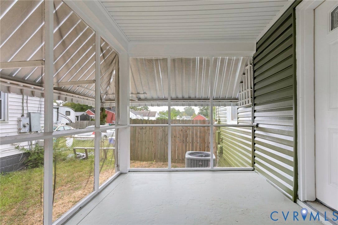 3504 Meadowbridge Road, Richmond, VA 23222 Screened porch with painted concrete flooring, an exterior door, and horizontal siding