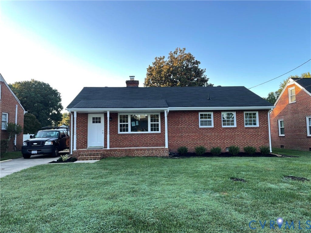 2315 Dee Kay Drive, Henrico, VA 23228 Brick exterior with white trim windows and a dark shingle roof