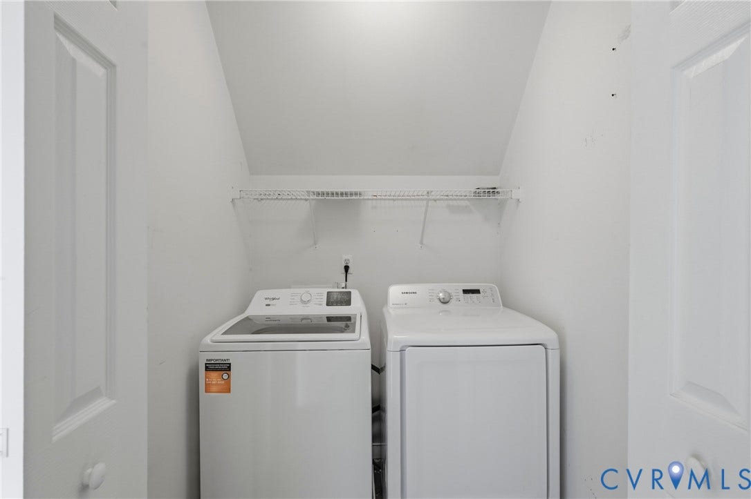 Laundry area with a wire shelf, washer, and dryer
