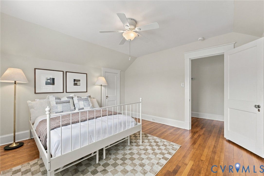 4905 Patterson Avenue, Richmond, VA 23226 Hardwood flooring, ceiling fan with integrated lighting, white trim, and a built-in closet with an open doorway