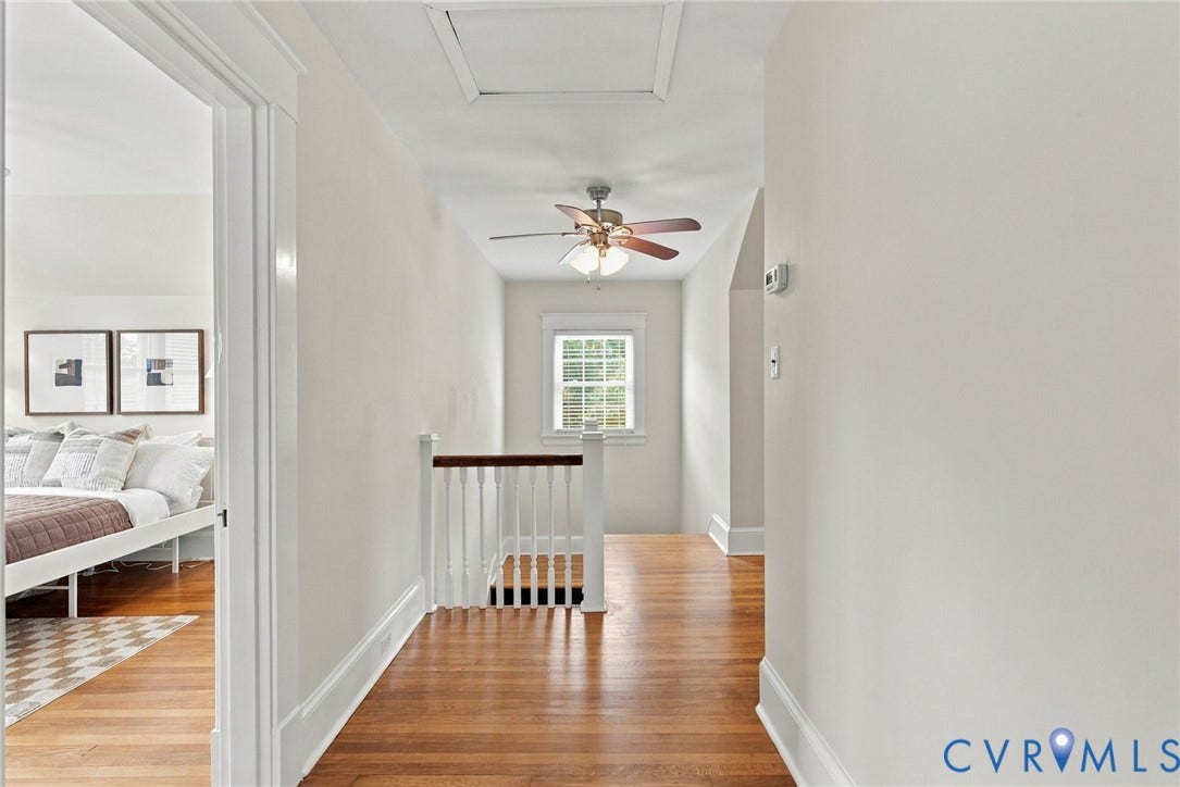 4905 Patterson Avenue, Richmond, VA 23226 Hardwood flooring, white painted walls, ceiling fan, window with grid pattern, and white painted balusters
