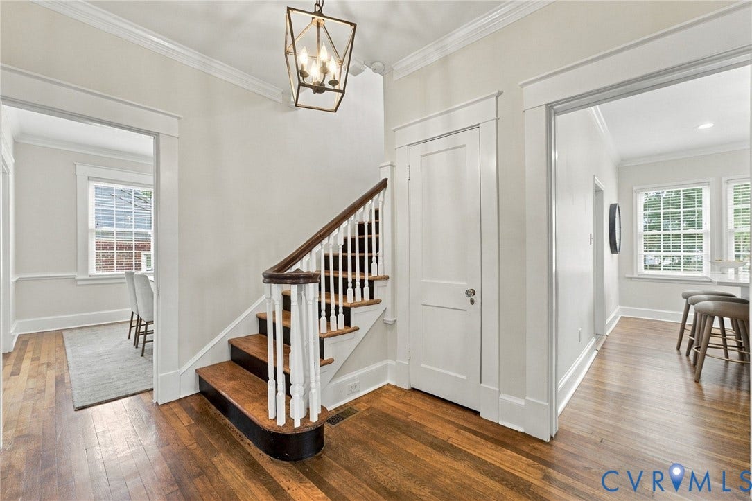 4905 Patterson Avenue, Richmond, VA 23226 Hardwood flooring, classic staircase with white balusters, crown molding, and a traditional lantern pendant light