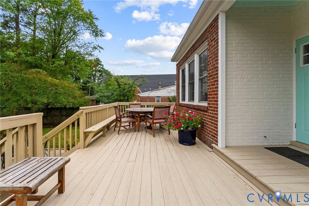 4905 Patterson Avenue, Richmond, VA 23226 Expansive outdoor deck with built-in bench seating, wood railing, and brick exterior accents