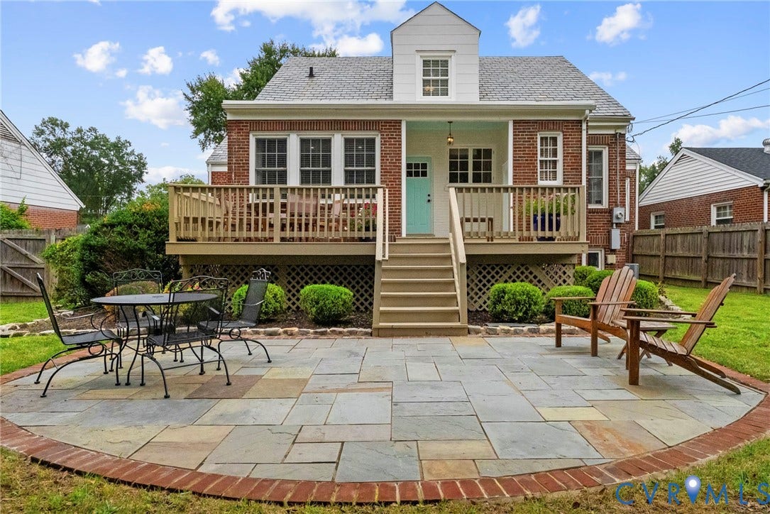 4905 Patterson Avenue, Richmond, VA 23226 Brick exterior, multi-level wood deck, exterior stairs, stone patio with brick border, dormer window