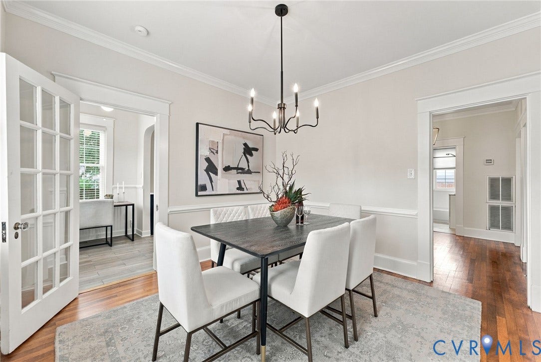 4905 Patterson Avenue, Richmond, VA 23226 Hardwood flooring, crown molding, chair rail molding, and a chandelier with a matte black finish