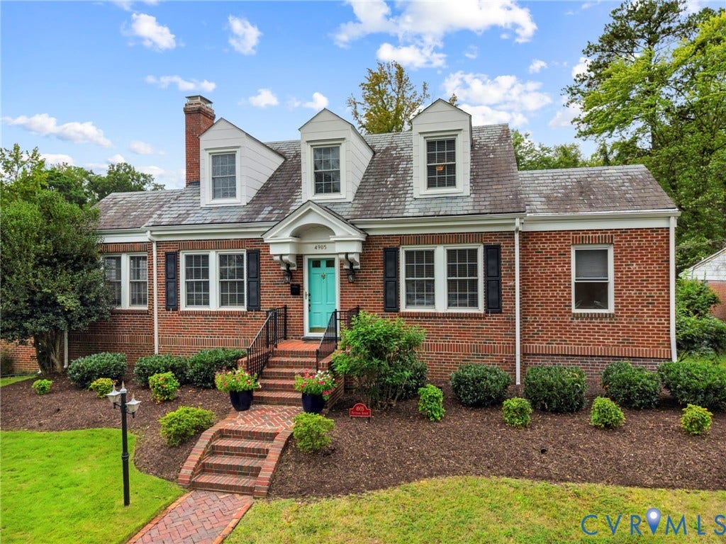 4905 Patterson Avenue, Richmond, VA 23226 Brick exterior with dormer windows and a teal entry door
