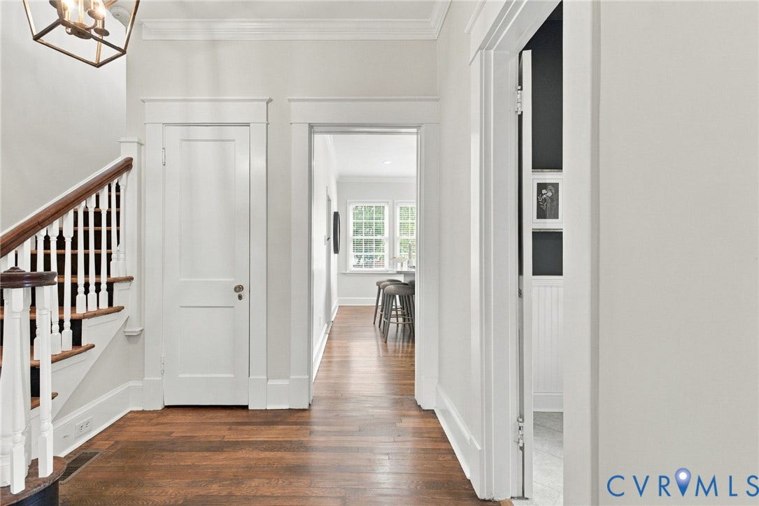 4905 Patterson Avenue, Richmond, VA 23226 Hardwood flooring, classic white trim, staircase with white balusters and wood handrail, recessed lighting, and a contemporary ceiling fixture