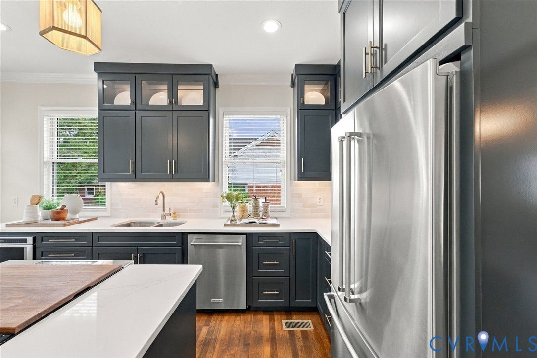 4905 Patterson Avenue, Richmond, VA 23226 Kitchen featuring stainless steel appliances, dark cabinetry, white countertops, and wood-finish flooring
