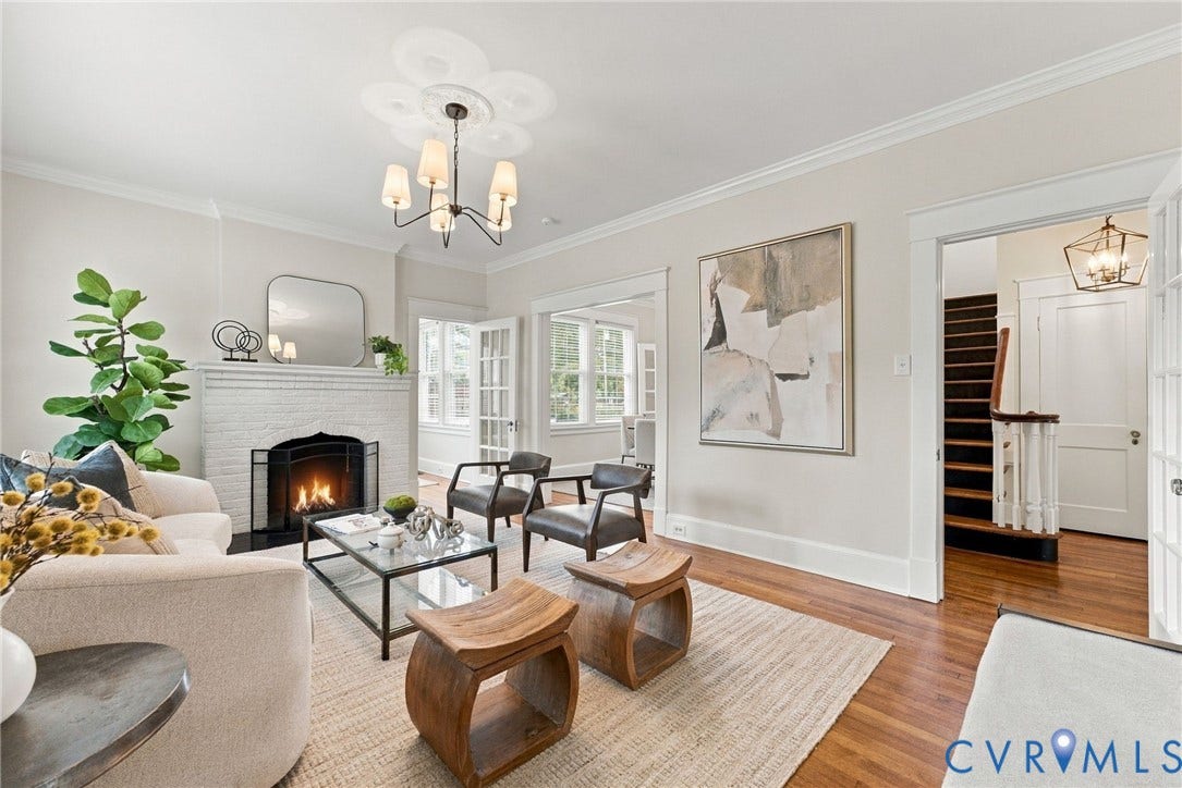 4905 Patterson Avenue, Richmond, VA 23226 Living area featuring hardwood flooring, a white brick fireplace, French doors, crown molding, and a multi-light chandelier
