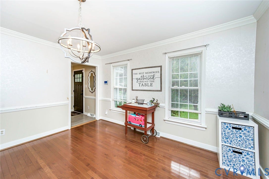 5640 Teterling Court, Lakewood Farms, Chester, VA 23831 Hardwood flooring, decorative chandelier, crown molding, double-hung windows, and a paneled entry door