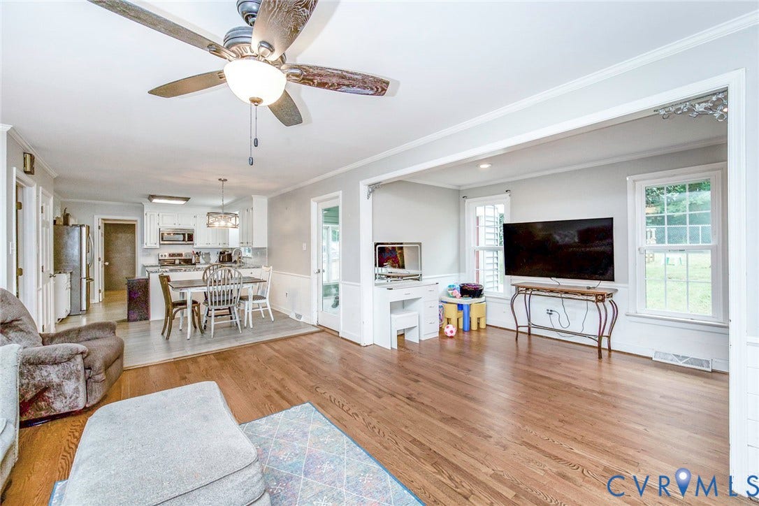 5640 Teterling Court, Lakewood Farms, Chester, VA 23831 Hardwood flooring throughout, white framed windows, and a ceiling fan with integrated lighting