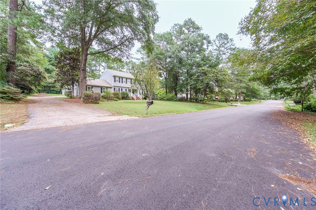 5640 Teterling Court, Lakewood Farms, Chester, VA 23831 Two-story residence with a light-colored exterior and dark shutters