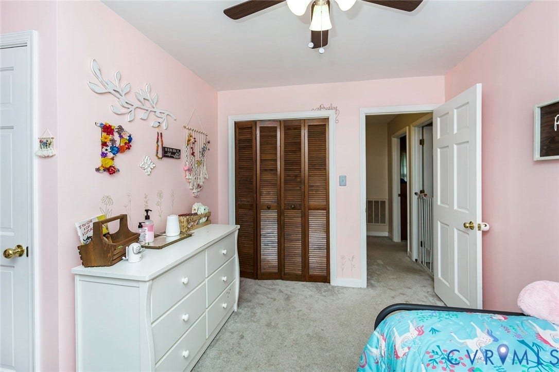 5640 Teterling Court, Lakewood Farms, Chester, VA 23831 Carpeted flooring, bi-fold louvered closet doors, and ceiling fan with light fixture