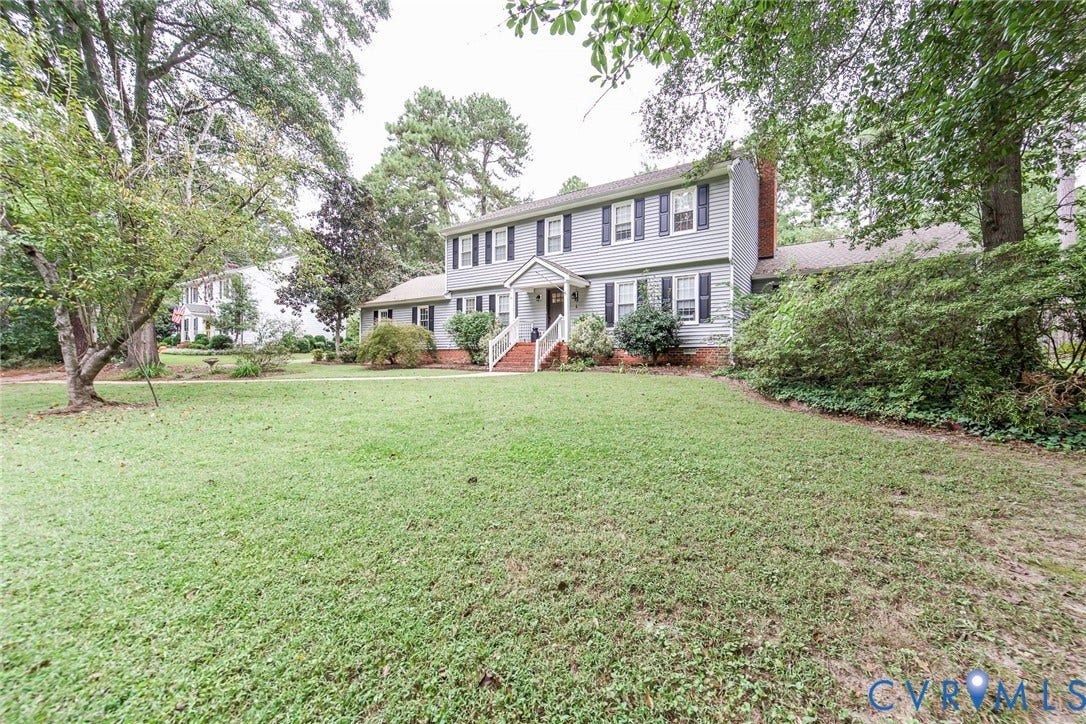 5640 Teterling Court, Lakewood Farms, Chester, VA 23831 Two-story exterior with siding, a brick chimney, and prominent front windows with shutters