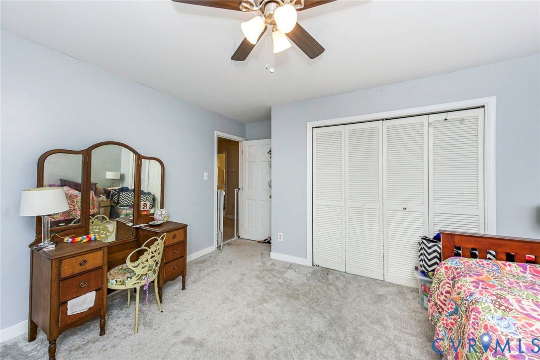 5640 Teterling Court, Lakewood Farms, Chester, VA 23831 Ceiling fan with light fixture, light gray wall paint, light gray carpet flooring, and bi-fold louvered closet doors