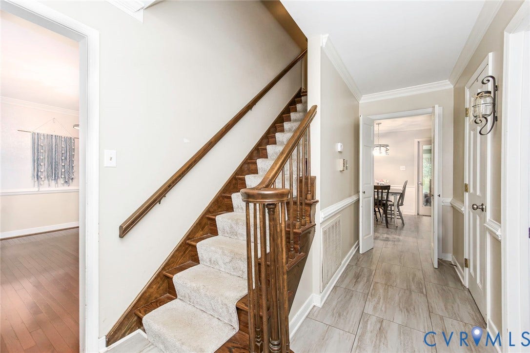 5640 Teterling Court, Lakewood Farms, Chester, VA 23831 Two-story staircase with wood-finish handrail and carpeted treads