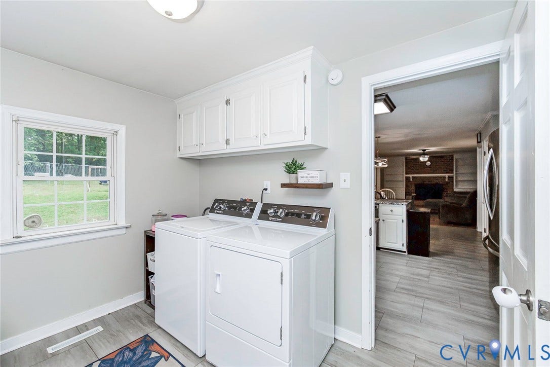 5640 Teterling Court, Lakewood Farms, Chester, VA 23831 Laundry area featuring light gray wall paint, white cabinetry, a single window, and light wood-finish flooring