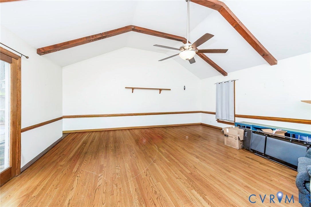 5640 Teterling Court, Lakewood Farms, Chester, VA 23831 Vaulted ceiling with exposed wood beams, wood-finish flooring, and a ceiling fan with integrated lighting