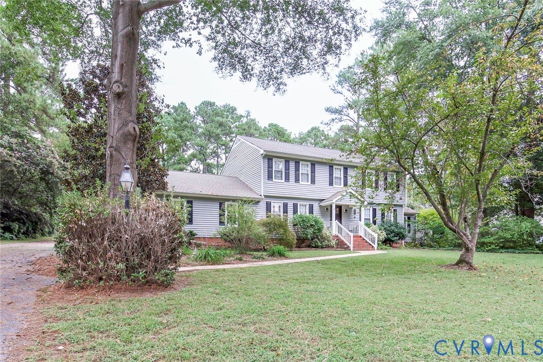 5640 Teterling Court, Lakewood Farms, Chester, VA 23831 Two-story residence featuring light gray siding with contrasting black shutters