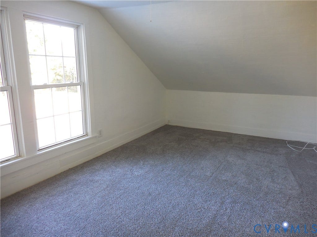 6507 Old Columbia Road, Columbia, Columbia, VA 23038 Twin multi-pane windows with white trim, gray carpeting, white walls, and an angled ceiling