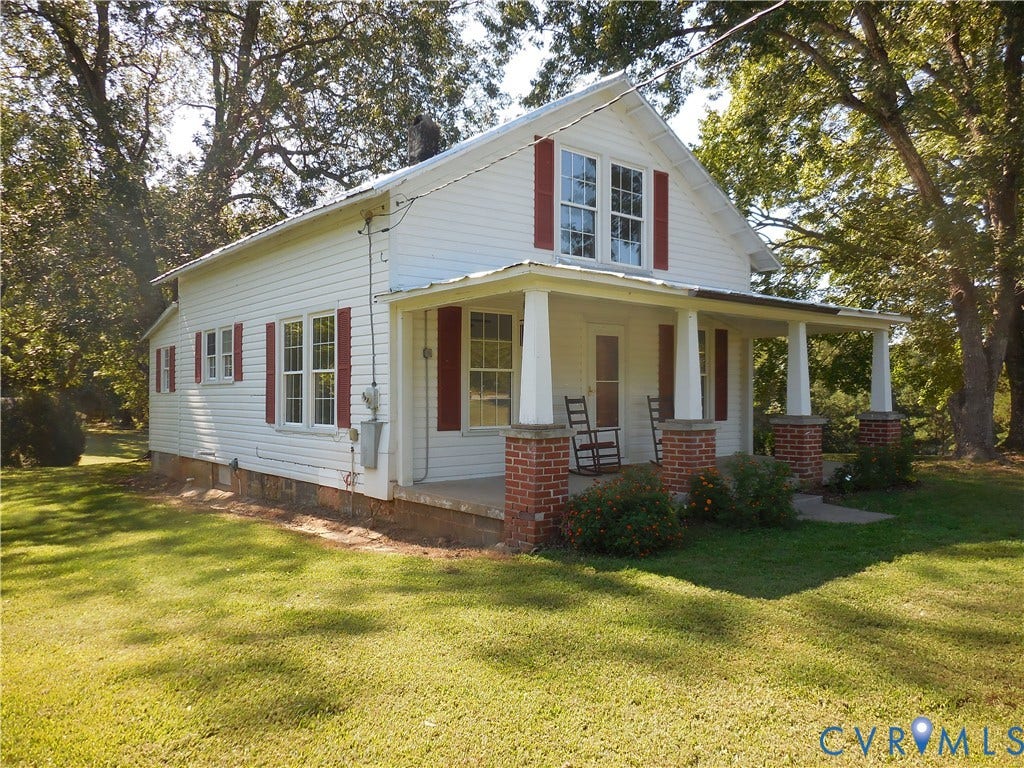 6507 Old Columbia Road, Columbia, Columbia, VA 23038 White siding exterior with a covered front porch featuring brick bases and white columns