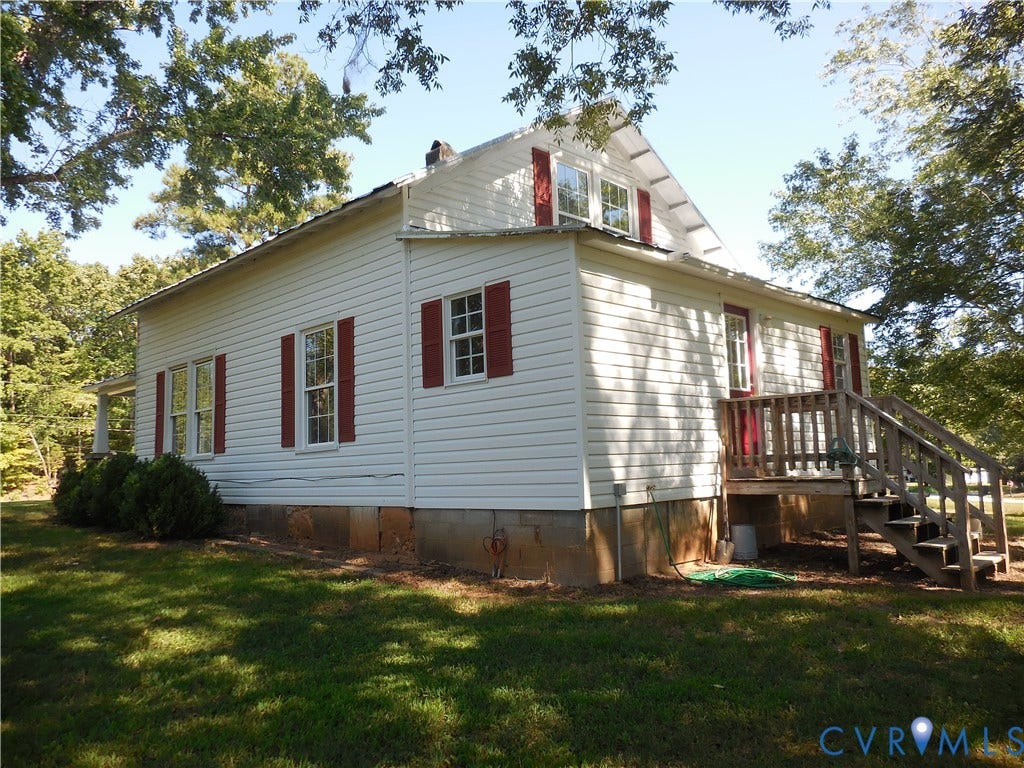 6507 Old Columbia Road, Columbia, Columbia, VA 23038 White siding exterior with red window shutters and a matching red door