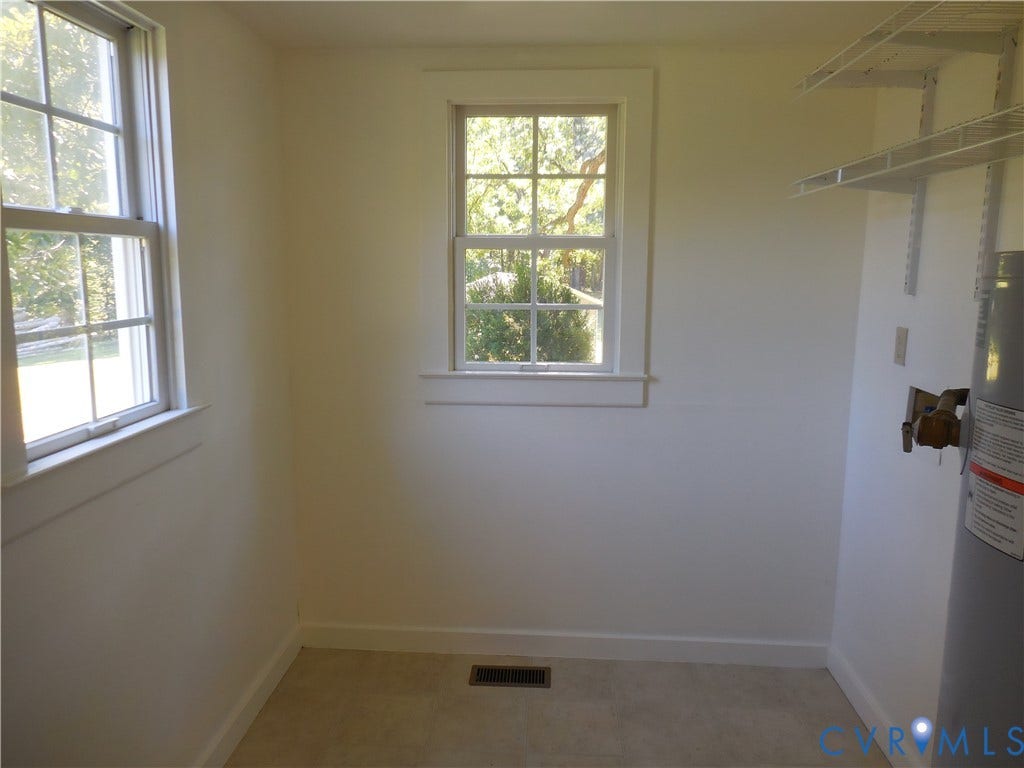 6507 Old Columbia Road, Columbia, Columbia, VA 23038 Two double-hung windows with white trim, light-toned wall finishes, and a neutral floor