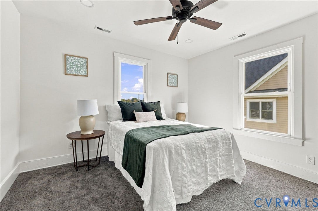 Neutral-toned wall-to-wall carpeting, ceiling fan with integrated lighting, recessed lighting, and white casing surrounding windows