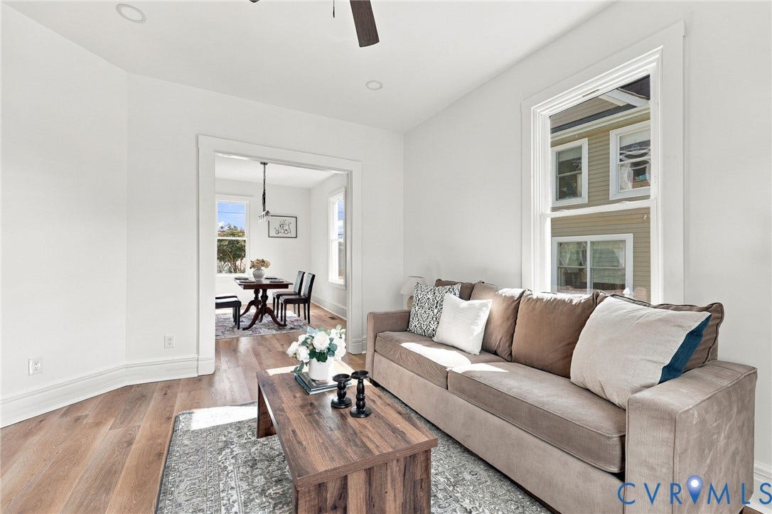 Interior featuring wood-finish flooring, recessed lighting, and wide-cased door frames
