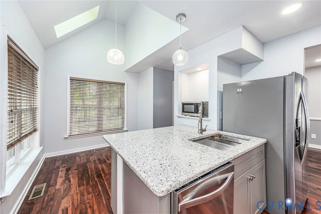 4605 English Cedar Court, Glen Allen, VA 23060 Kitchen island with a light-colored speckled countertop and undermount sink